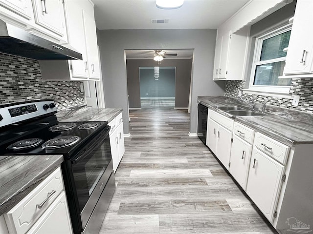 6910 Cornelius Ln, Pensacola, FL 32505 - kitchen with electric stove, under cabinet range hood, a ceiling fan, and backsplash
