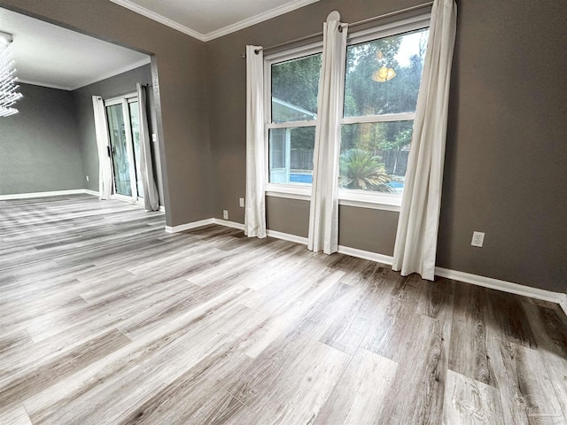 6910 Cornelius Ln, Pensacola, FL 32505 - spare room with ornamental molding and wood finished floors