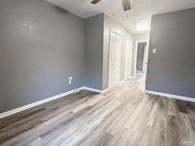 6910 Cornelius Ln, Pensacola, FL 32505 - unfurnished room featuring ceiling fan, wood finished floors, and a textured ceiling