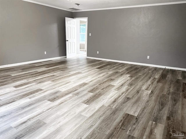 6910 Cornelius Ln, Pensacola, FL 32505 - unfurnished room featuring wood finished floors and crown molding