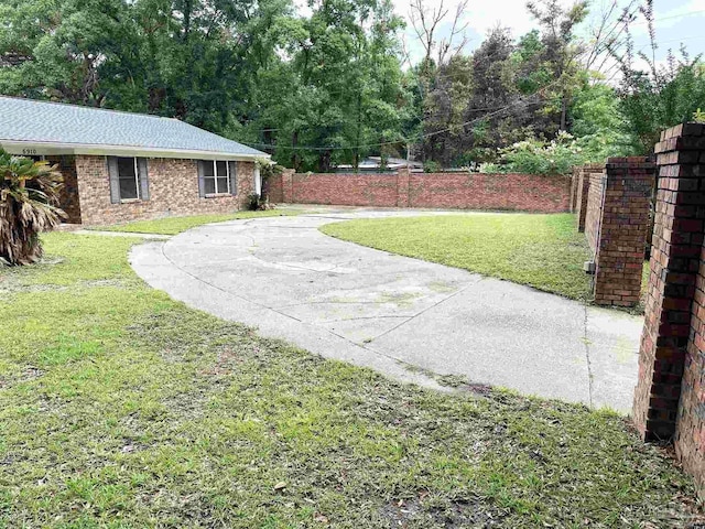 6910 Cornelius Ln, Pensacola, FL 32505 - view of yard with a patio area