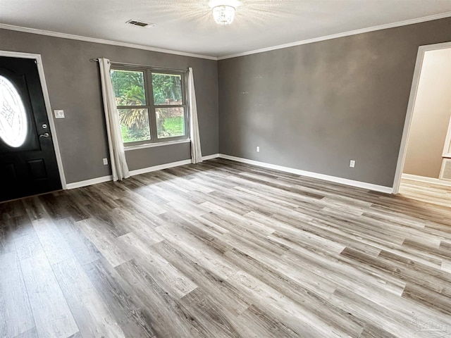 6910 Cornelius Ln, Pensacola, FL 32505 - entrance foyer featuring wood finished floors and crown molding