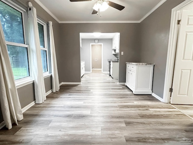 6910 Cornelius Ln, Pensacola, FL 32505 - hallway with light wood-style flooring and crown molding