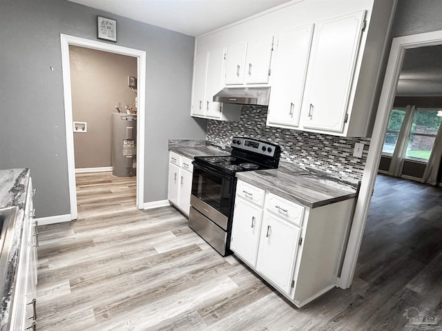 6910 Cornelius Ln, Pensacola, FL 32505 - kitchen featuring stainless steel electric range, electric water heater, under cabinet range hood, light wood-style flooring, and tasteful backsplash