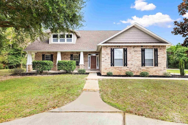 craftsman-style house with a front yard