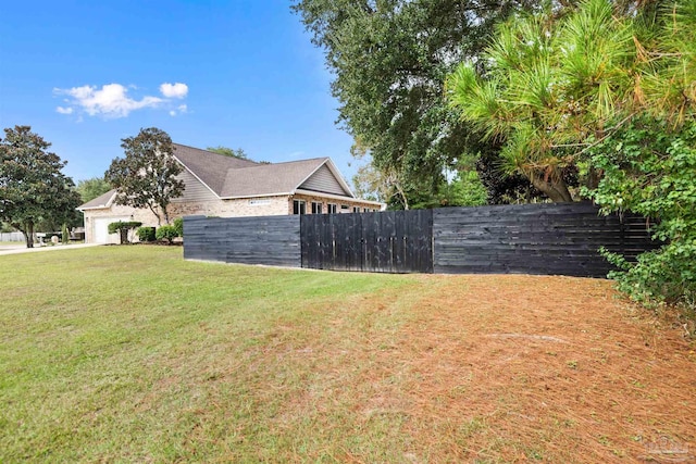 view of side of home featuring a lawn