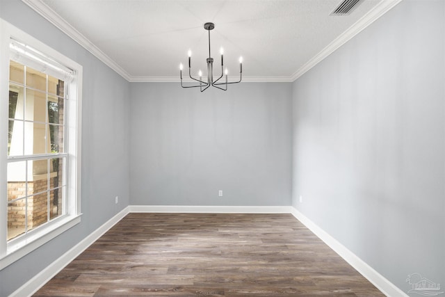 unfurnished dining area featuring a chandelier, dark wood-type flooring, and ornamental molding