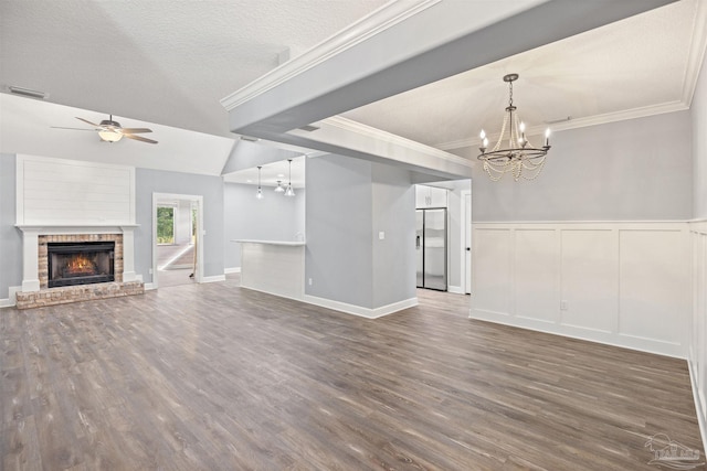 unfurnished living room featuring a fireplace, dark hardwood / wood-style flooring, and crown molding