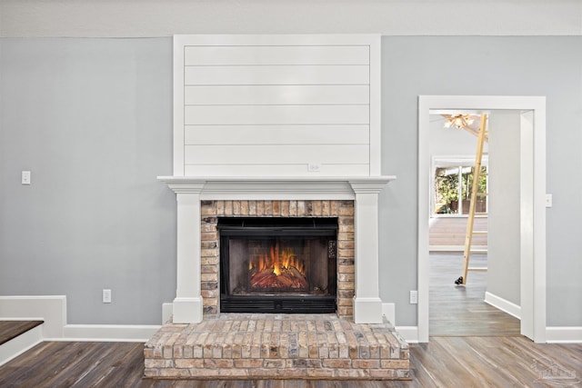 room details with hardwood / wood-style flooring and a fireplace