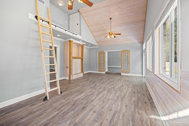 unfurnished living room with french doors, high vaulted ceiling, a wealth of natural light, and wood-type flooring