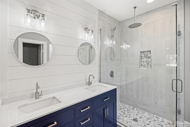 bathroom with vanity and an enclosed shower