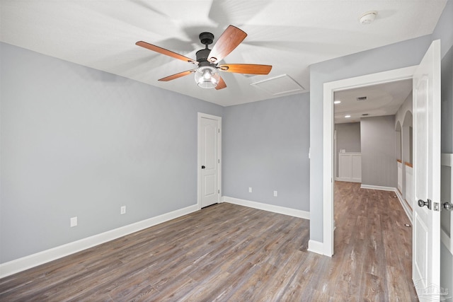 empty room featuring wood-type flooring and ceiling fan