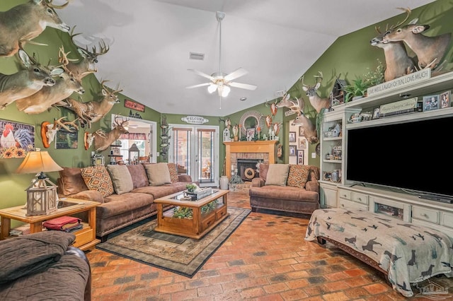 6552 Emerald Forest Dr, Milton, FL 32570 - living room with lofted ceiling, a ceiling fan, brick flooring, and a brick fireplace
