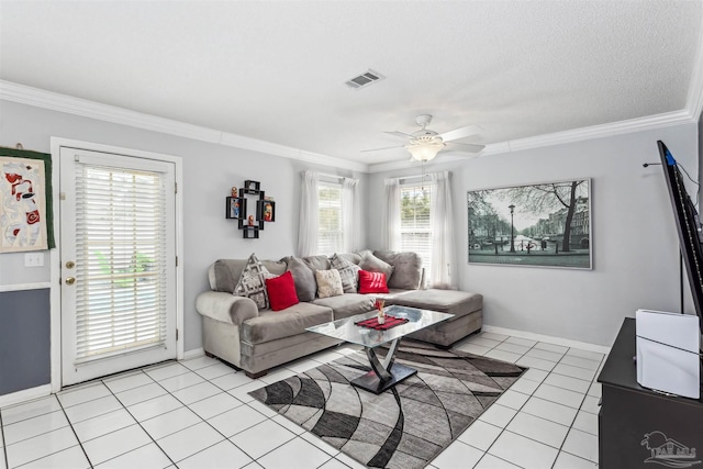 tiled living room featuring ceiling fan, a textured ceiling, and crown molding