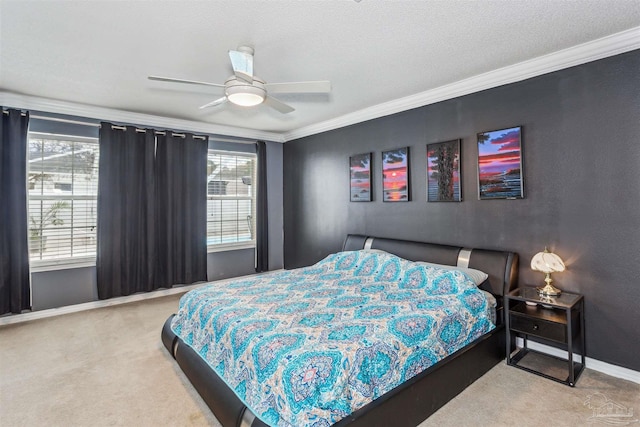 bedroom with ceiling fan, carpet floors, and ornamental molding