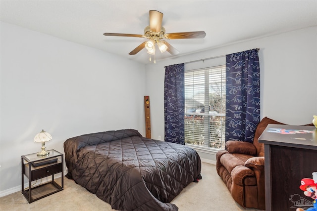 bedroom with light carpet and ceiling fan