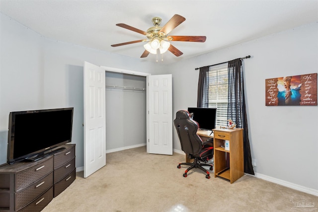 office featuring light carpet and ceiling fan