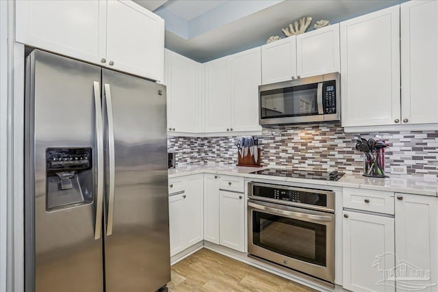13599 Perdido Key Dr Unit T-2C, Perdido Key, FL 32507 - kitchen featuring appliances with stainless steel finishes, light countertops, and backsplash