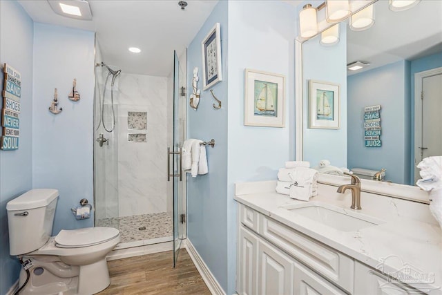 13599 Perdido Key Dr Unit T-2C, Perdido Key, FL 32507 - bathroom featuring a stall shower, vanity, and wood finished floors
