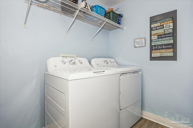 13599 Perdido Key Dr Unit T-2C, Perdido Key, FL 32507 - washroom featuring independent washer and dryer and wood finished floors