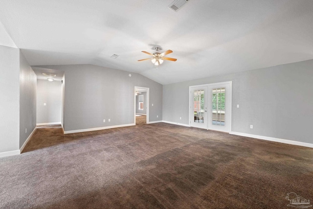 interior space with visible vents, carpet floors, lofted ceiling, baseboards, and ceiling fan