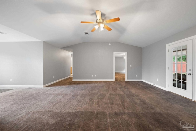 additional living space featuring a ceiling fan, visible vents, baseboards, lofted ceiling, and dark carpet