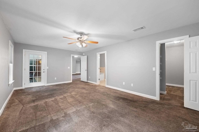 unfurnished bedroom featuring visible vents, baseboards, and carpet floors