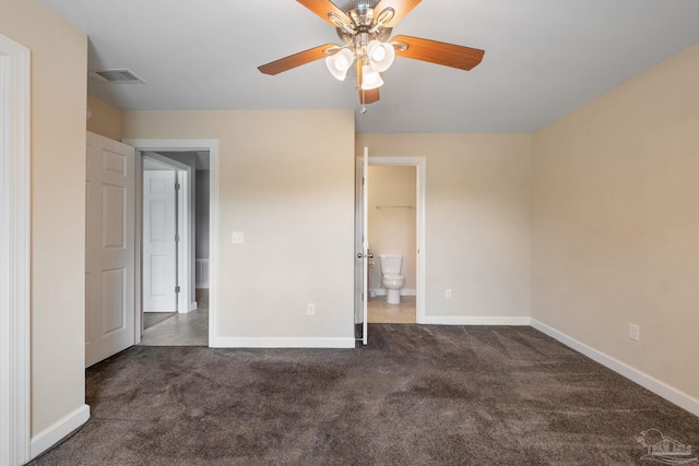 unfurnished bedroom featuring baseboards, carpet flooring, and visible vents