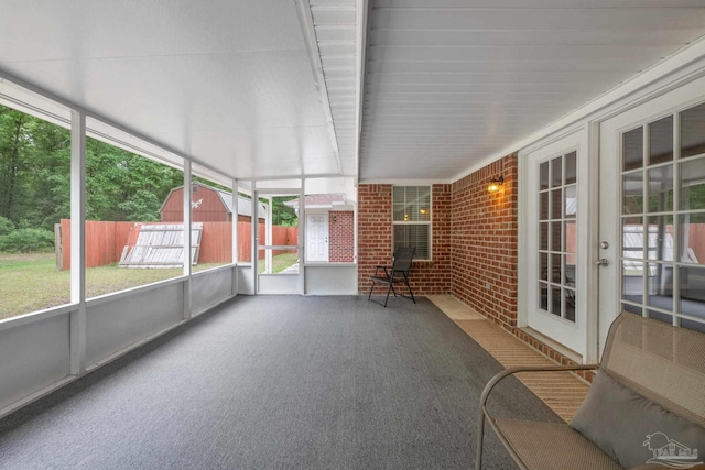 unfurnished sunroom featuring french doors