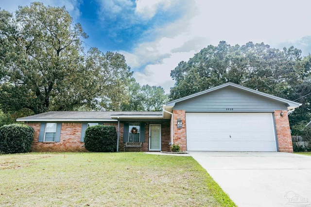 ranch-style home with a front yard and a garage