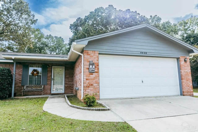 4408 Chantilly Way, Milton, FL 32583 - view of front facade with brick siding, concrete driveway, an attached garage, and a front lawn
