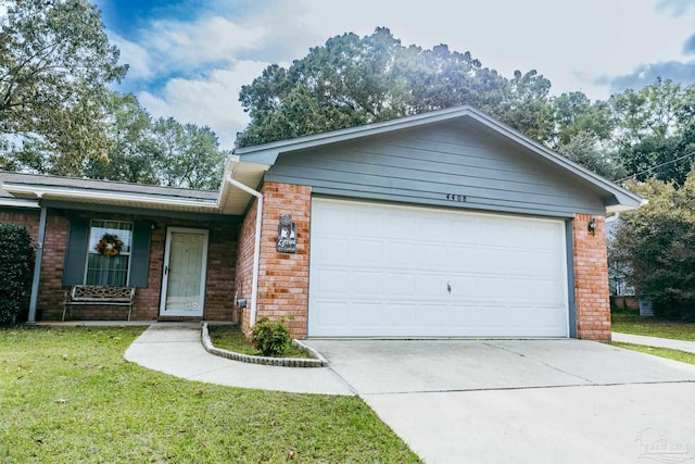 ranch-style house featuring a front lawn and a garage