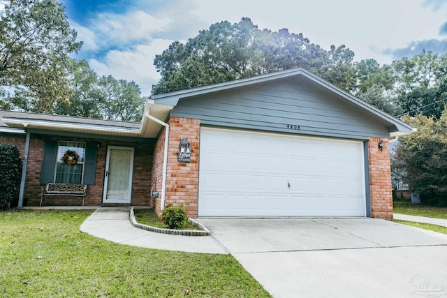 4408 Chantilly Way, Milton, FL 32583 - view of front of property with brick siding, an attached garage, concrete driveway, and a front lawn