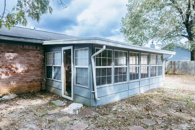 view of home's exterior featuring a sunroom