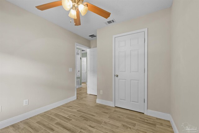 3963 Edgefield St, Pace, FL 32571 - unfurnished bedroom with light wood-style flooring, baseboards, and ceiling fan
