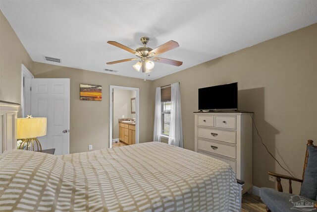3963 Edgefield St, Pace, FL 32571 - bedroom with wood finished floors, baseboards, and a ceiling fan