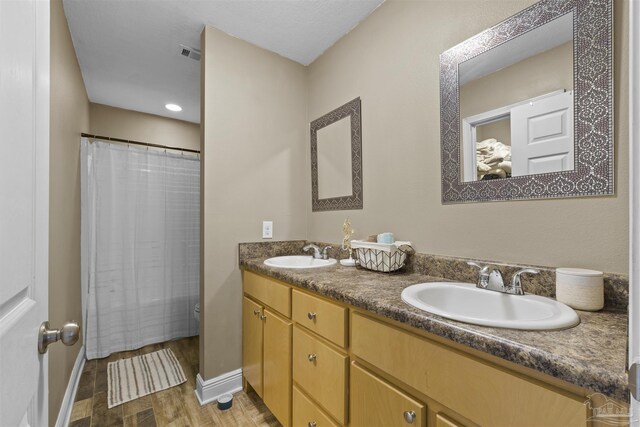 3963 Edgefield St, Pace, FL 32571 - bathroom featuring double vanity, toilet, baseboards, and curtained shower