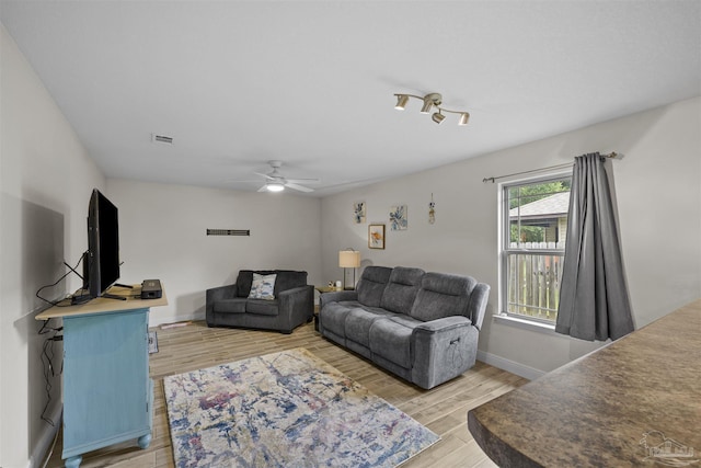 3963 Edgefield St, Pace, FL 32571 - living room with light wood finished floors, baseboards, and ceiling fan