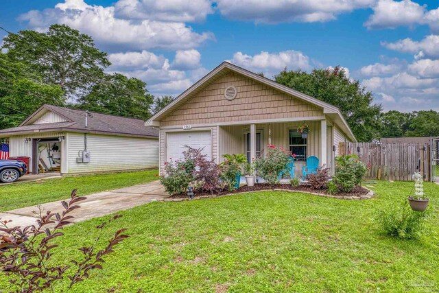 3963 Edgefield St, Pace, FL 32571 - view of front of property featuring driveway, covered porch, and a garage