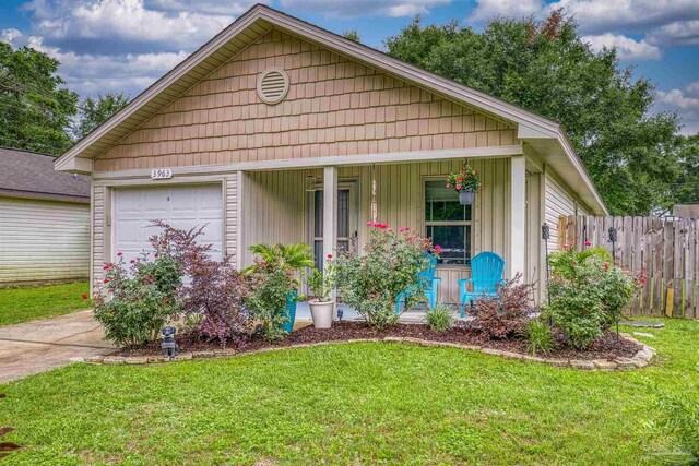 3963 Edgefield St, Pace, FL 32571 - view of front of house with covered porch, an attached garage, and concrete driveway