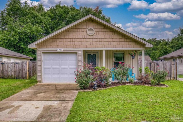 3963 Edgefield St, Pace, FL 32571 - view of front facade with concrete driveway, a porch, board and batten siding, and an attached garage