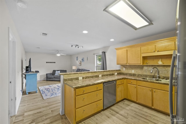3963 Edgefield St, Pace, FL 32571 - kitchen with stainless steel appliances, a sink, a peninsula, light wood-style floors, and recessed lighting