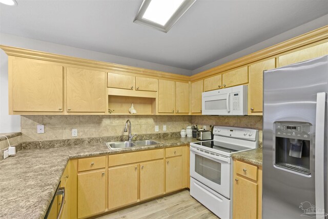 3963 Edgefield St, Pace, FL 32571 - kitchen with white appliances, a sink, light wood-type flooring, light brown cabinets, and decorative backsplash