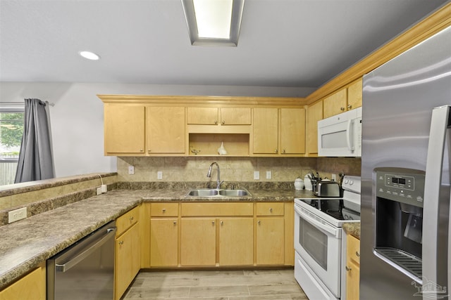 3963 Edgefield St, Pace, FL 32571 - kitchen with appliances with stainless steel finishes, a sink, light brown cabinets, light wood-style floors, and backsplash