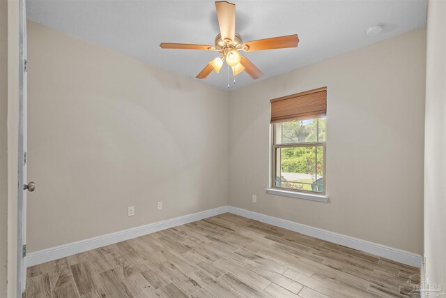 3963 Edgefield St, Pace, FL 32571 - spare room with wood finished floors, baseboards, ceiling fan, and a smoke detector