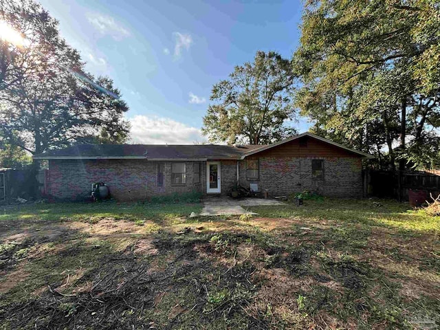 back of property featuring a patio area