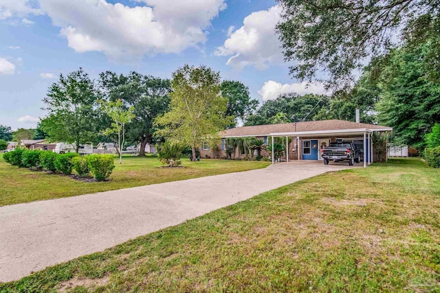 surrounding community with a yard, an attached carport, and driveway