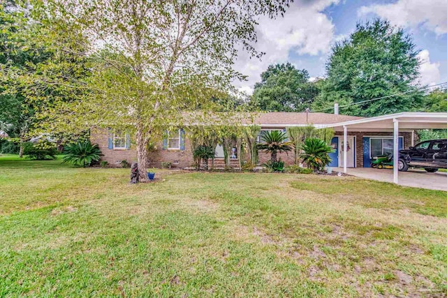 ranch-style house featuring a carport and a front lawn