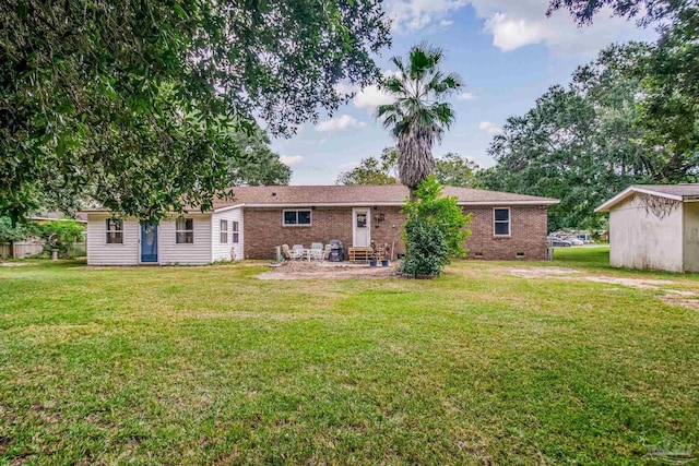 back of house with a yard