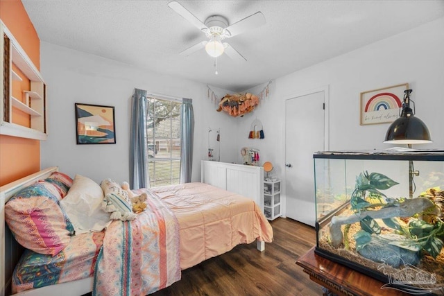 1404 Stanford Rd, Gulf Breeze, FL 32563 - bedroom with ceiling fan, a textured ceiling, and wood finished floors